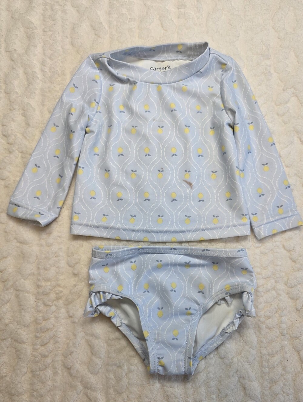 Adorable Carter’s 2-piece baby swim set in size 6 months.